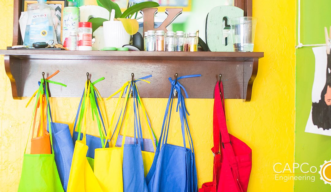 banner for a kindergarten class showing aprons and school supplies
