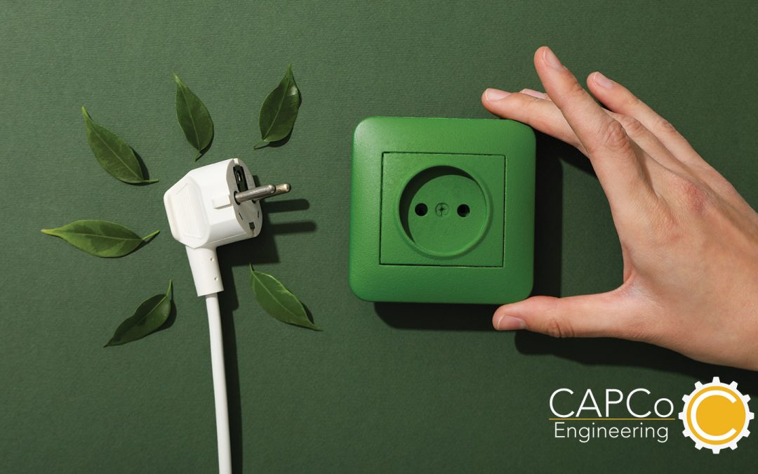 image of a plug and outlet with a green background for capco's earth day blog post