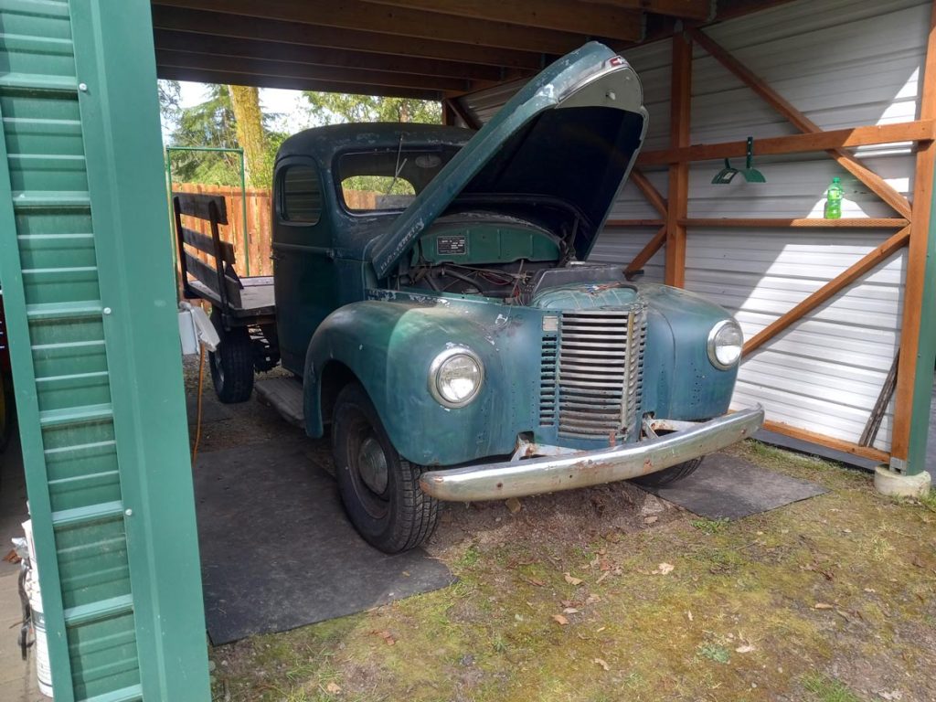 kb-2 truck in garage with hood open